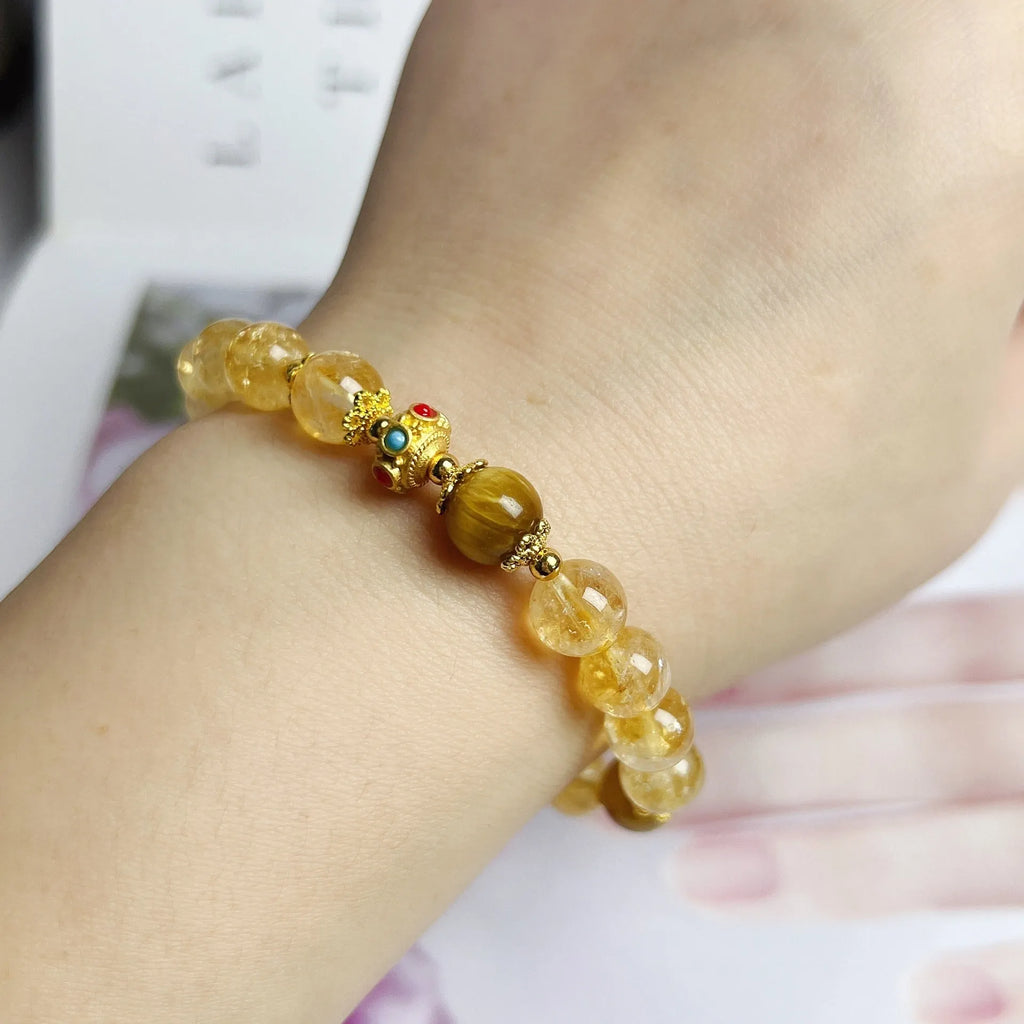 Women's citrine bracelet with floral tassel design, handcrafted crystal jewellery