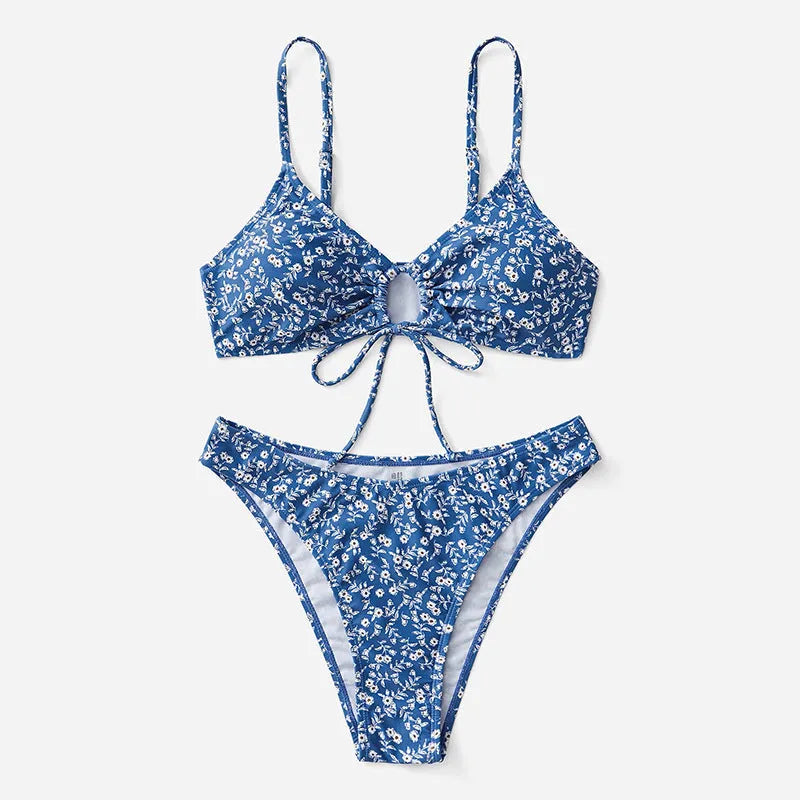 Blue women's three-piece swimsuit set comprising a top and shorts on a mannequin.
