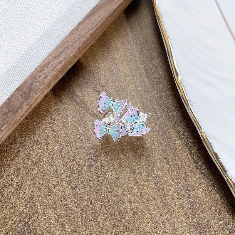 Adjustable copper insect ring with dripping oil finish in one of three colour variants.