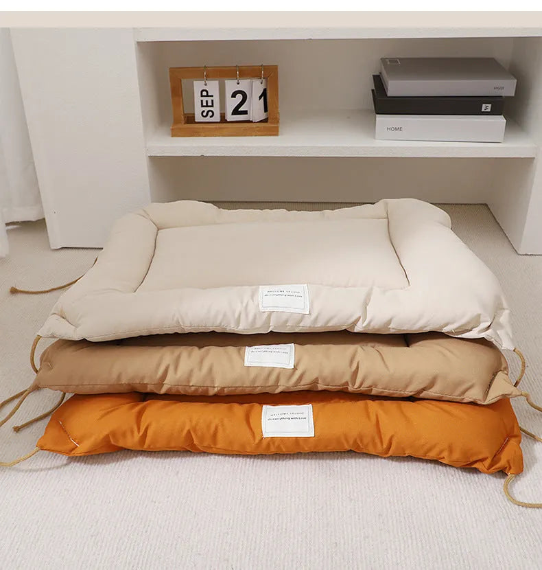 Tied cage cushion pet nest in beige, coffee or orange colours showing four size options for small dogs and cats