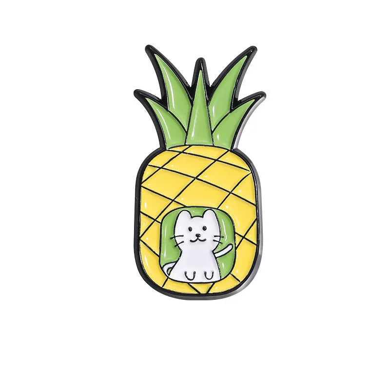 Colourful cartoon-style fruit metal brooch with pin back on a denim jacket lapel.