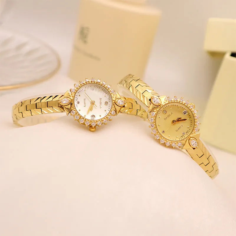 Women's gold vintage style quartz watch with diamond embossed bracelet.