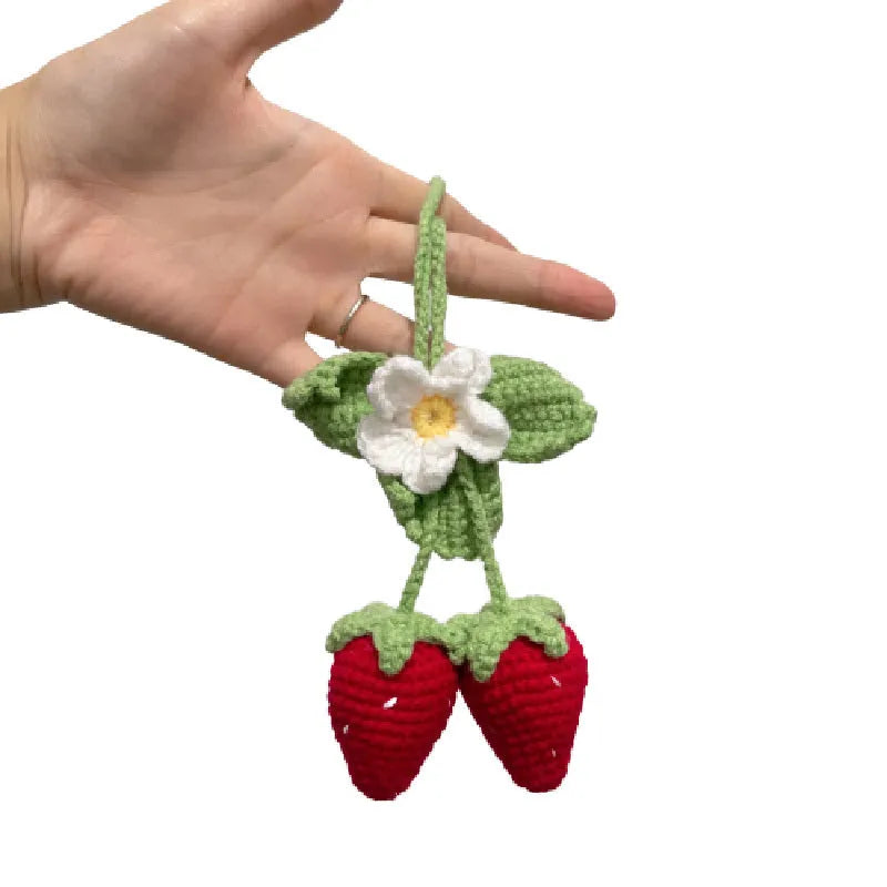 Handmade strawberry-shaped car pendant made from cotton and hemp knitting wool.
