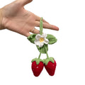 Handmade strawberry-shaped car pendant made from cotton and hemp knitting wool.