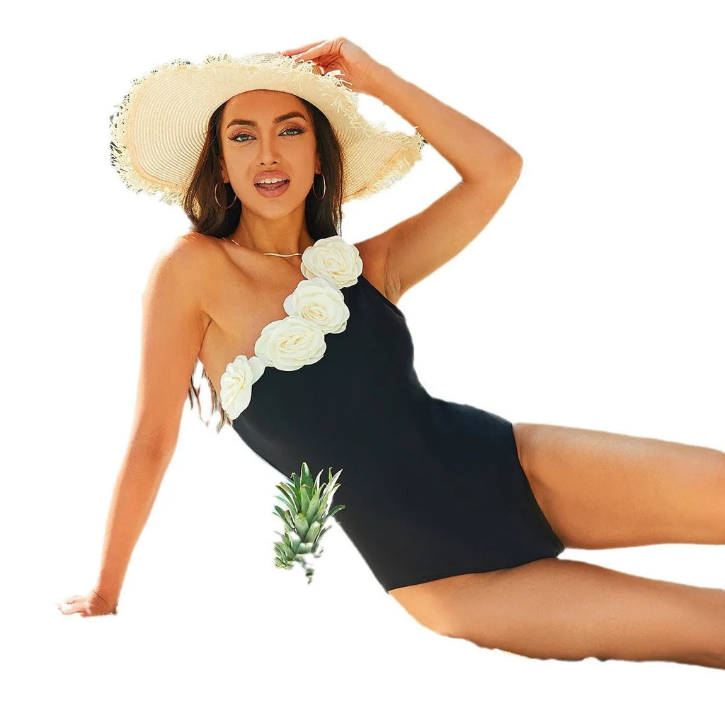 Solid black one-piece swimsuit for women on a mannequin, showing the classic design and nylon material.