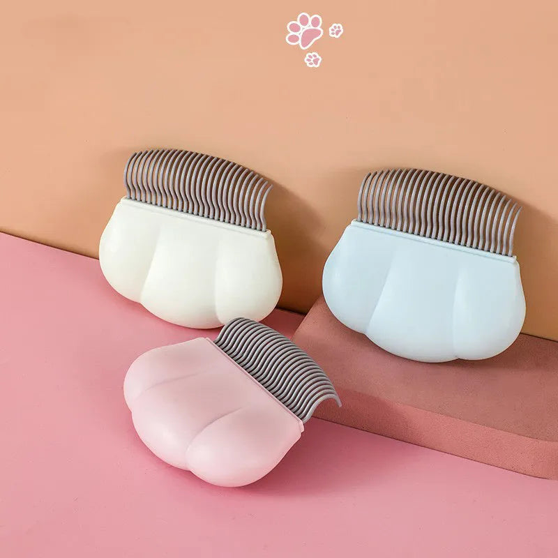 Paw Soft deshedding brush grooming tool for cats and dogs on white background