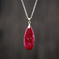 Genuine jade water drop pendant necklace with 18K gold plating in four colour options on a metal chain.