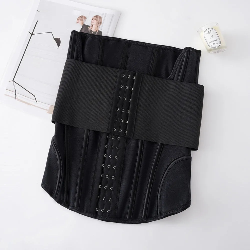 Black nylon belly band waist trainer with belt tie, laid flat.