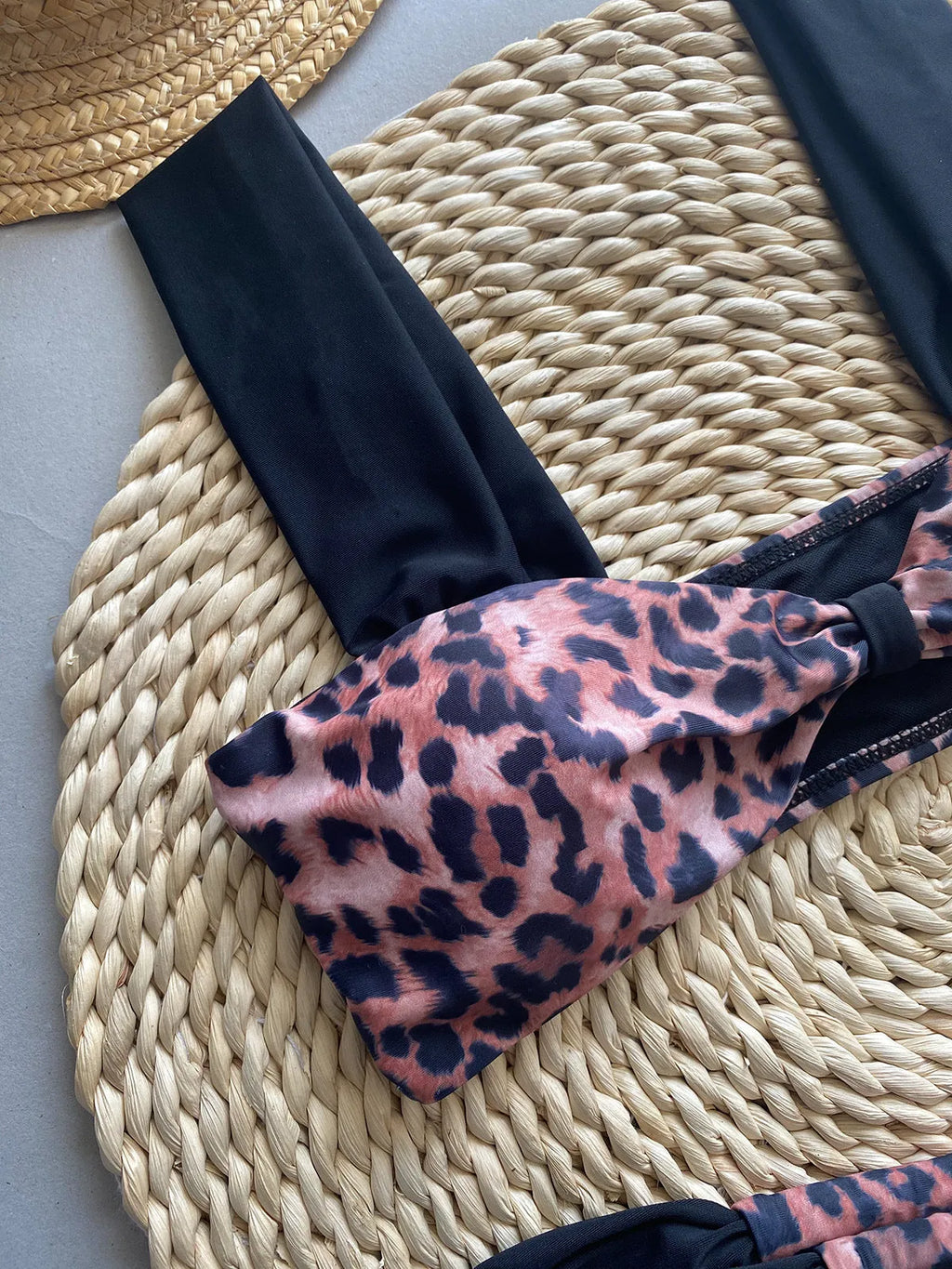 Women's leopard print bikini with tube top and split bottoms in black or leopard pattern
