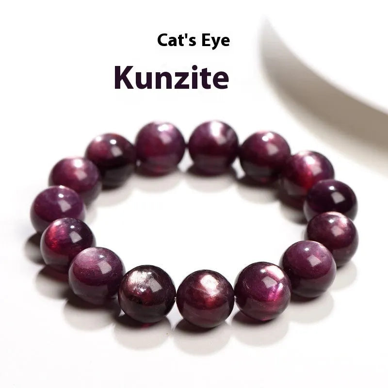 Purple lepidolite crystal round beads bracelet on a wrist, showing polished gemstone beads.