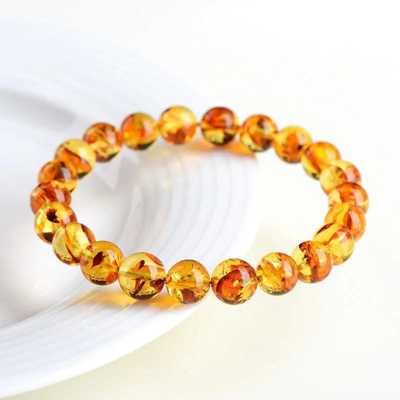 Natural yellow piebald amber bracelet with geometric polished beads.
