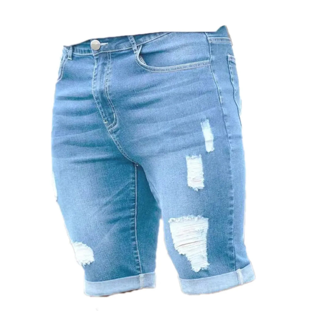 Sky blue men's denim shorts with multi-hole manual wear distressing and low waist straight cut