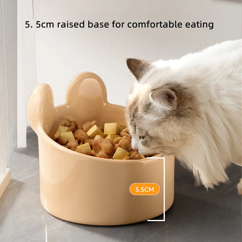 White and yellow ceramic pet bowls with rabbit and bear motifs in two sizes