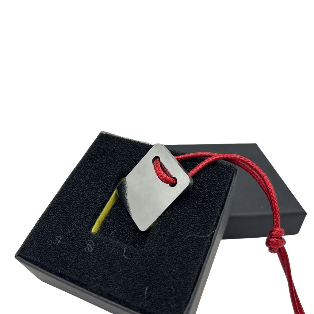 Silver-coloured metal car paint repair scraper tool for vehicle scratch and dent touch-ups.