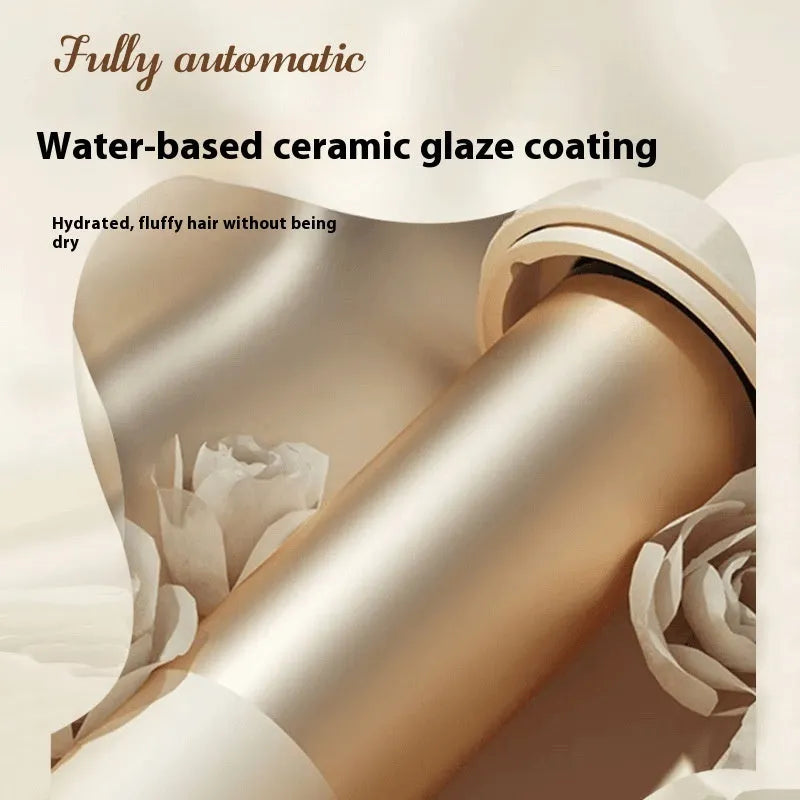 White and pink automatic hair curler with a rotating 32mm ceramic barrel and digital temperature display.