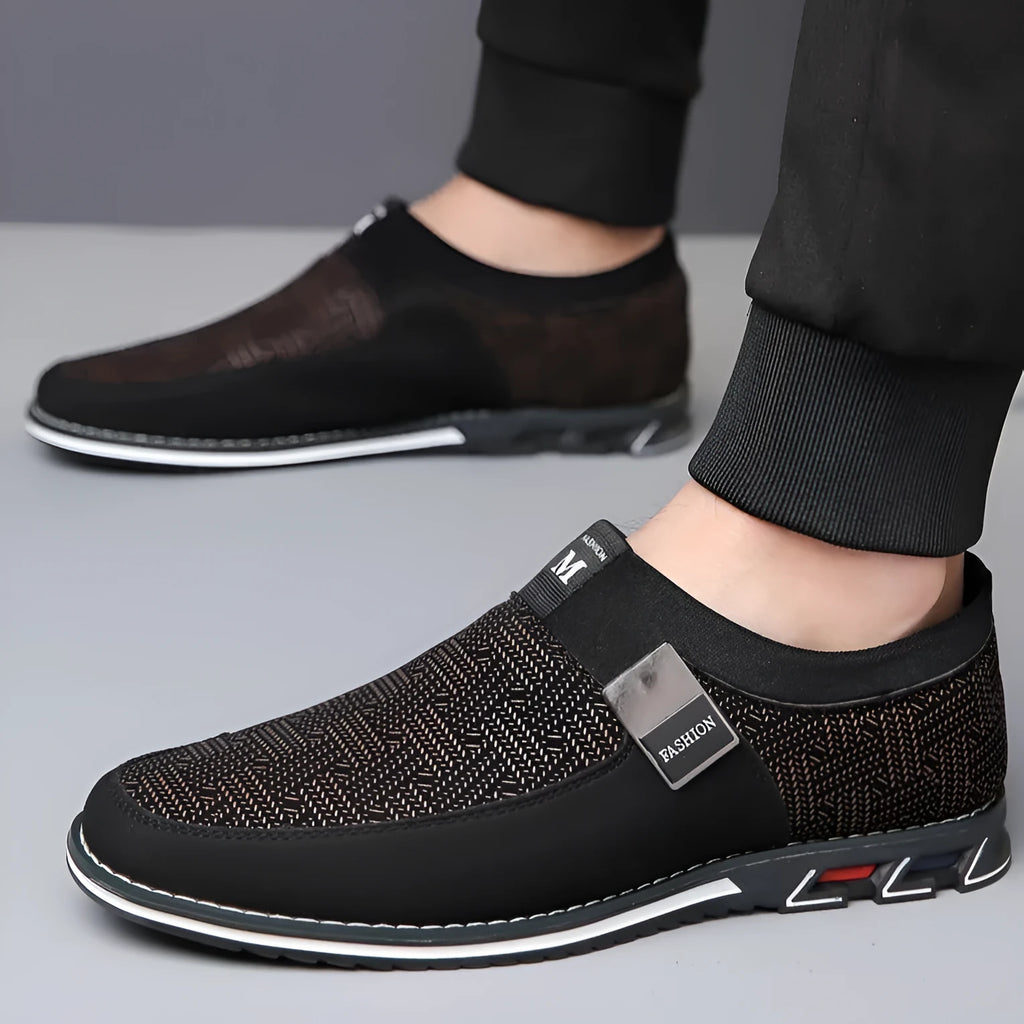 Men's grey and white synthetic leather slip-on casual shoes with a square toe and flat rubber sole.