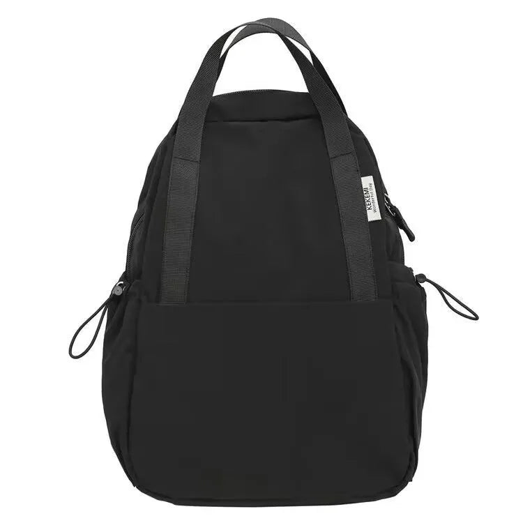 Solid colour nylon backpack with curved shoulder straps shown in five colour options