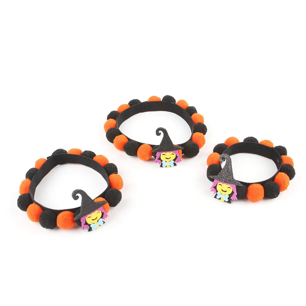 Halloween pet collar with a fur ball decoration in a pumpkin design, shown in size M.