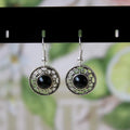 Handmade Miao silver geometric flower disk earrings with turquoise stone in black, blue, or red.