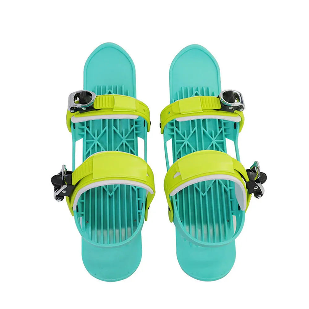 Green and black mini ski skates made from ABS plastic, nylon, and aluminium alloy on snow