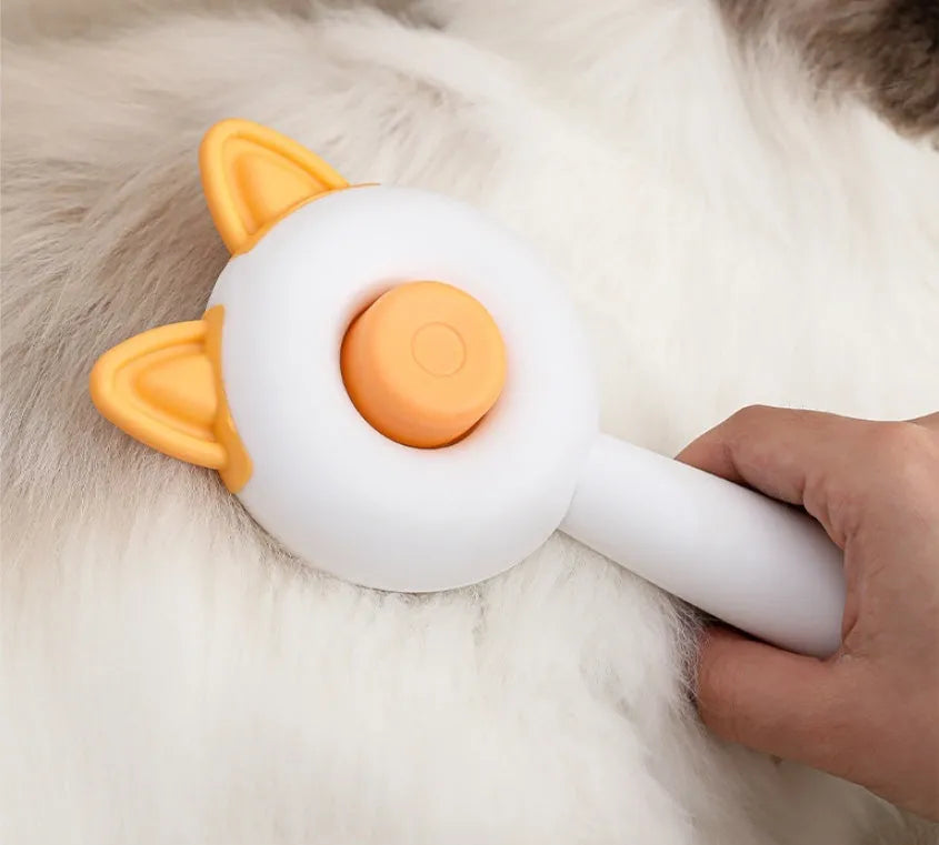 Self-cleaning cat grooming brush with stainless steel bristles in greenish white and orange white colour options