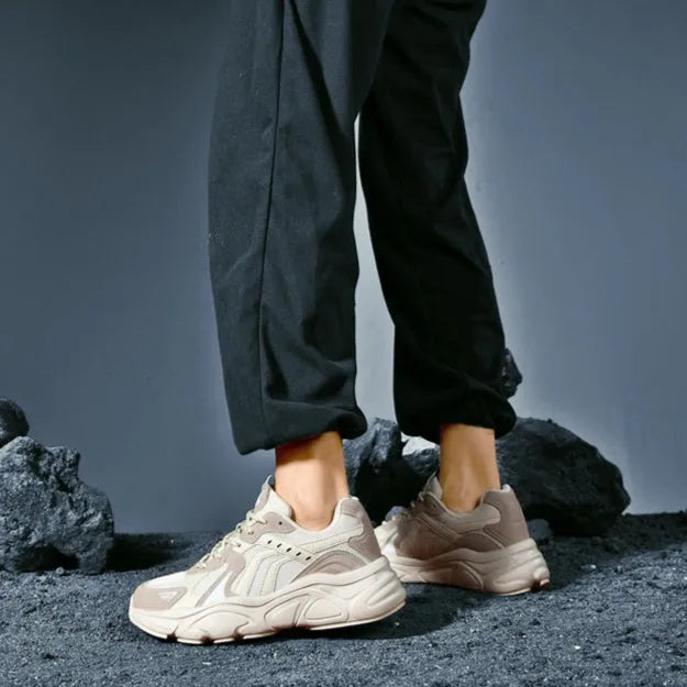 Men's collapsible casual sneakers in black and beige colours showing flat storage position