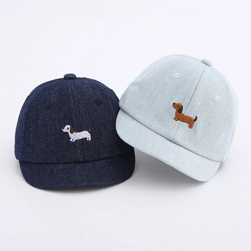Baby denim baseball cap with puppy patch in light blue, dark blue, and black colour options.