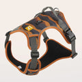 Orange reflective dog chest and back harness with an integrated hand-holding walking rope.