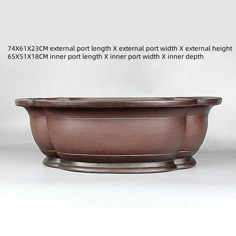 Handmade antique crabapple shaped purple clay flowerpot measuring 74x61x23cm.