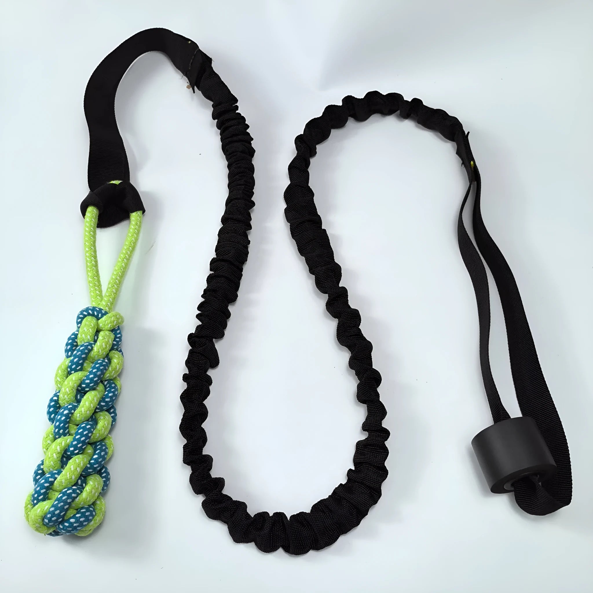 Green cotton rope dog tug toy with a knotted ball handle on a white background.