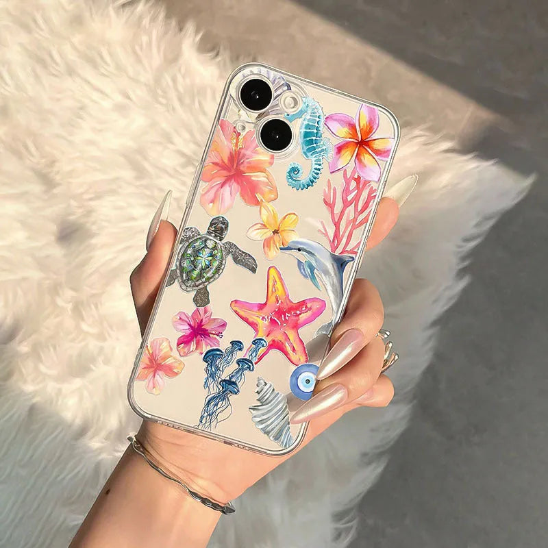 Transparent iPhone case with dolphin turtle design showing through clear TPU material