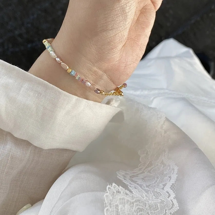 Women's natural pearl bracelet and necklace set with silver pearls and gilded purple 14K plating.
