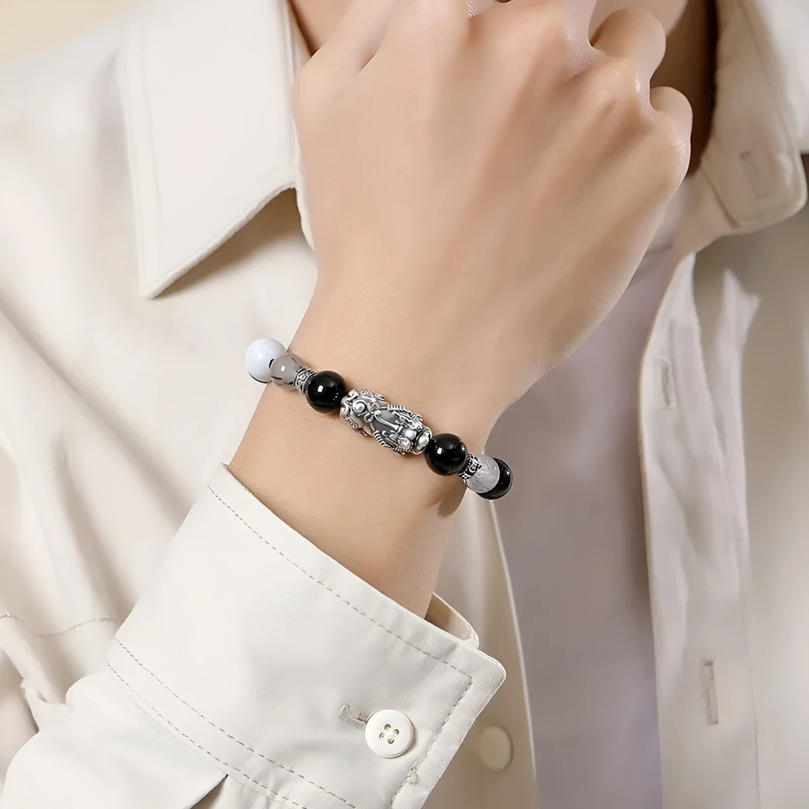 Hand-woven 999 sterling silver couple bracelet in black, white, or set with animal tassel details.