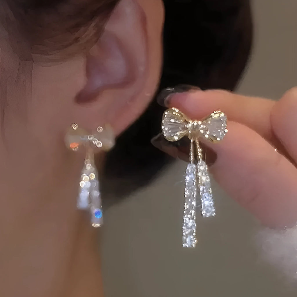Gold alloy butterfly earrings with rhinestone accents and bow design for women