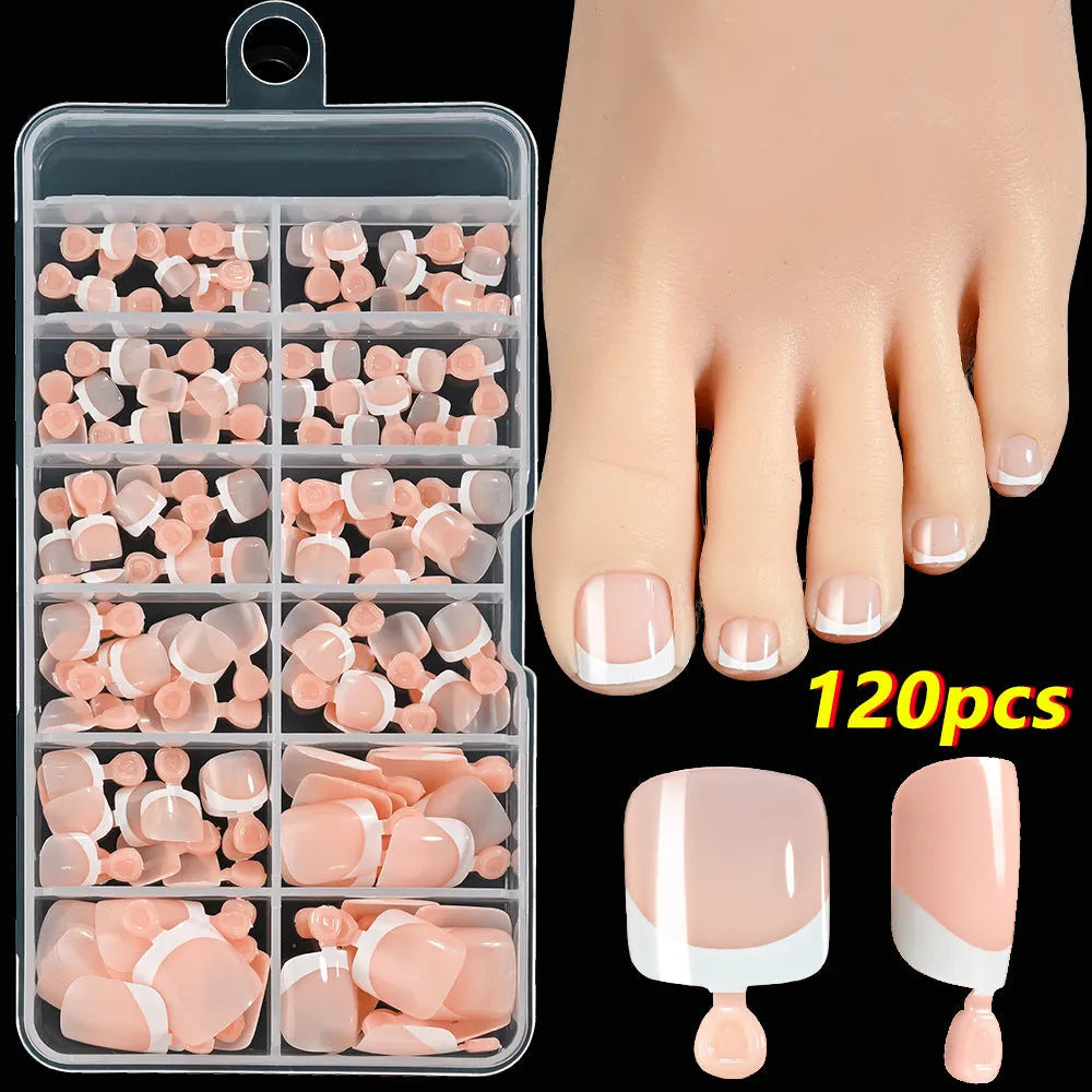120 piece boxed set of full square short artificial toenails with French white edge design on nude base