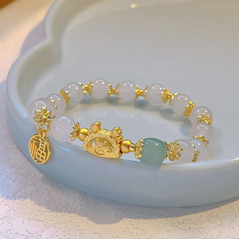 Floral glazed bracelet with zodiac animal charm and electroplated glass beads in multiple colour options