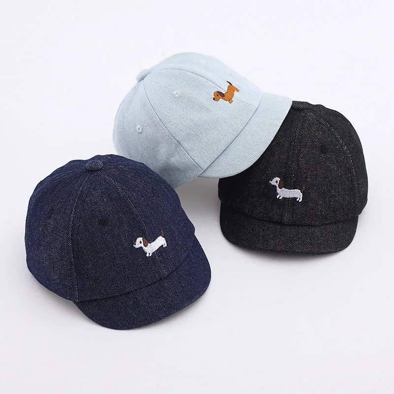 Baby denim baseball cap with puppy patch in light blue, dark blue, and black colour options.