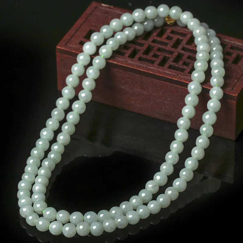 Adjustable jade bead necklace with white green round beads showing length adjustment from 21cm to 50cm