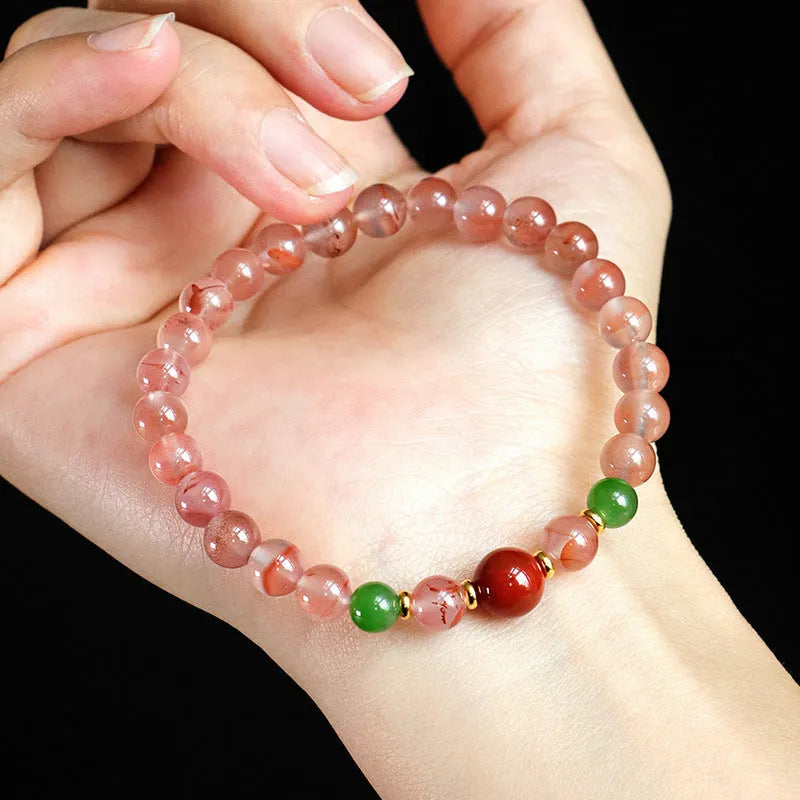Women's ice floating south red white agate fishtail bracelet showing natural stone colour variation and textured design