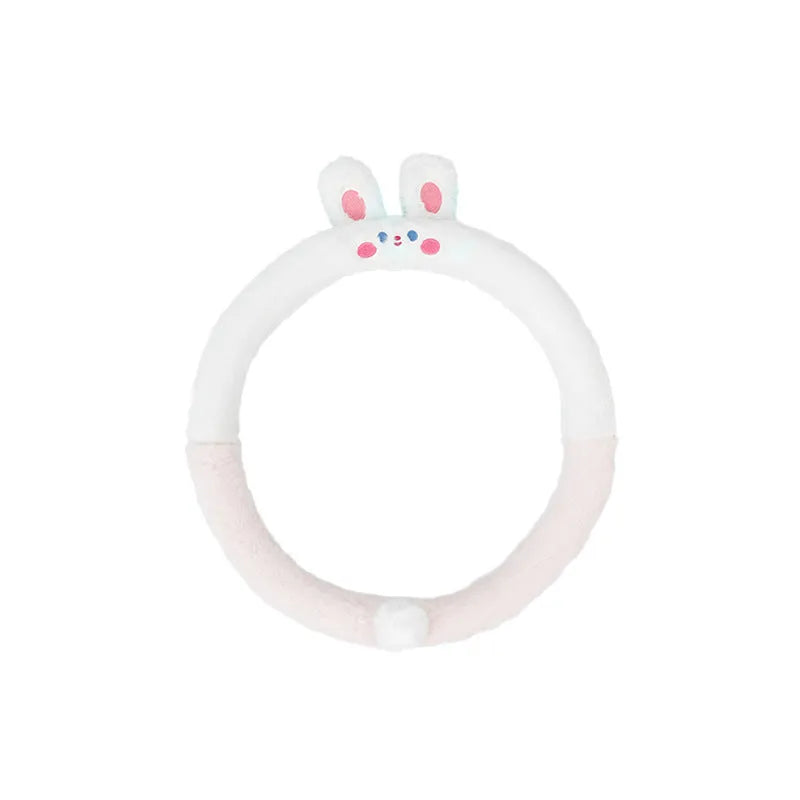 Plush cartoon animal steering wheel cover with embroidery, shown fitted on a car wheel.