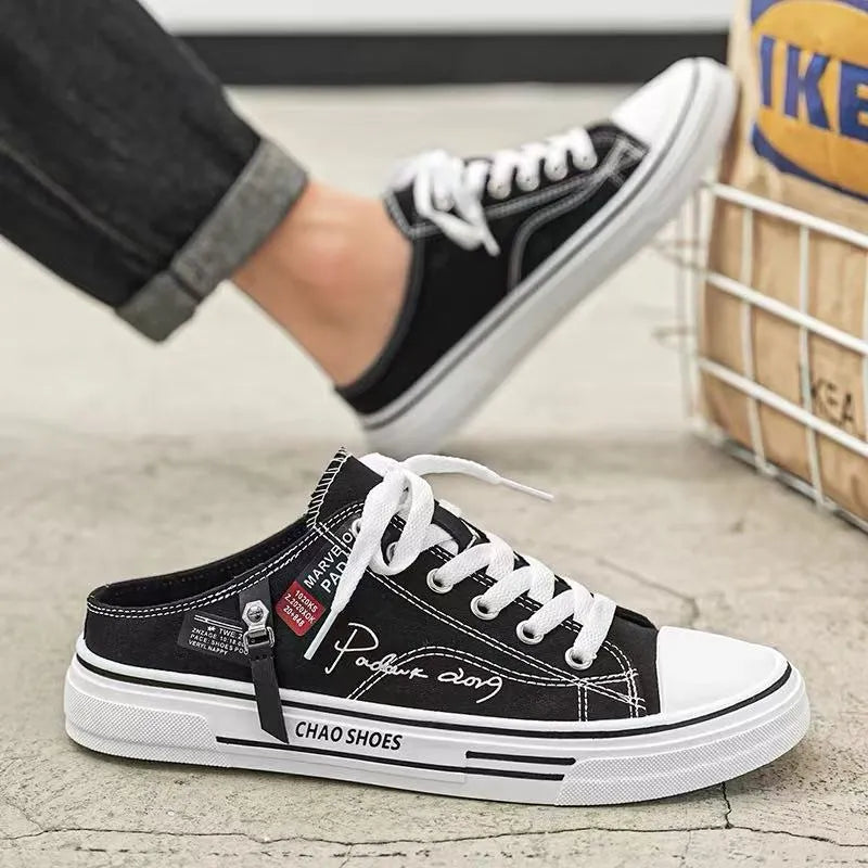 Men's canvas slip-on casual shoes in black colour with round toe and PVC sole