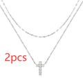 S925 sterling silver double layer twin diamond cross pendant on a gold plated clavicle chain.