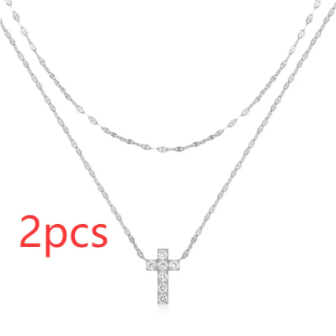 S925 sterling silver double layer twin diamond cross pendant on a gold plated clavicle chain.