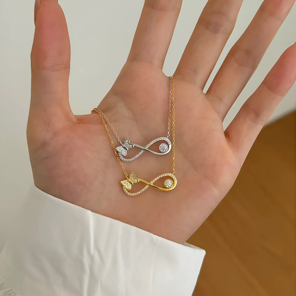Mobius bow zircon clavicle chain in 925 sterling silver with electroplated gold or platinum finish and butterfly design