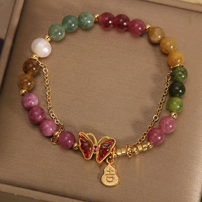 Natural jade coloured tourmaline butterfly agate bracelet for women showing pendant detail