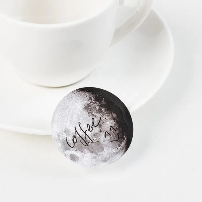 Boxed set of 45 black moon phase and calendar planet self-adhesive stickers.