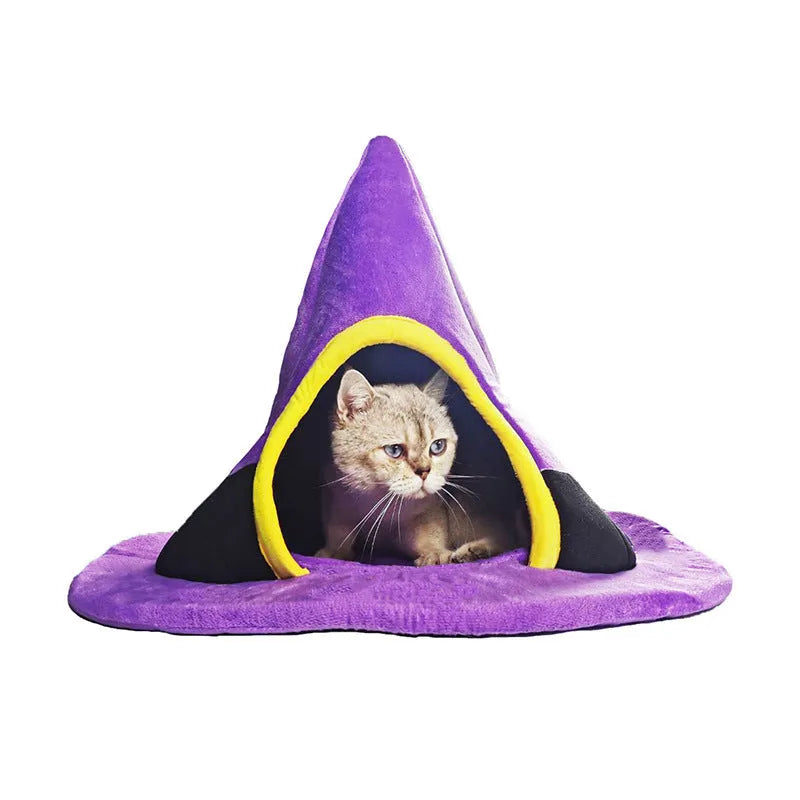 Purple witch hat-shaped cat bed for small pets, shown on a floor.