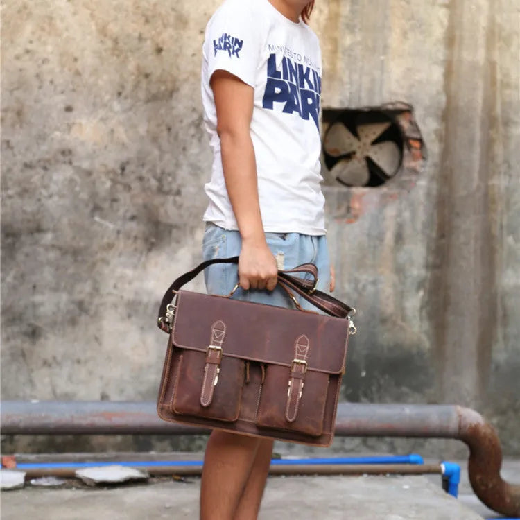 Men's yellow brown cowhide leather messenger bag with shoulder strap and nylon lining.