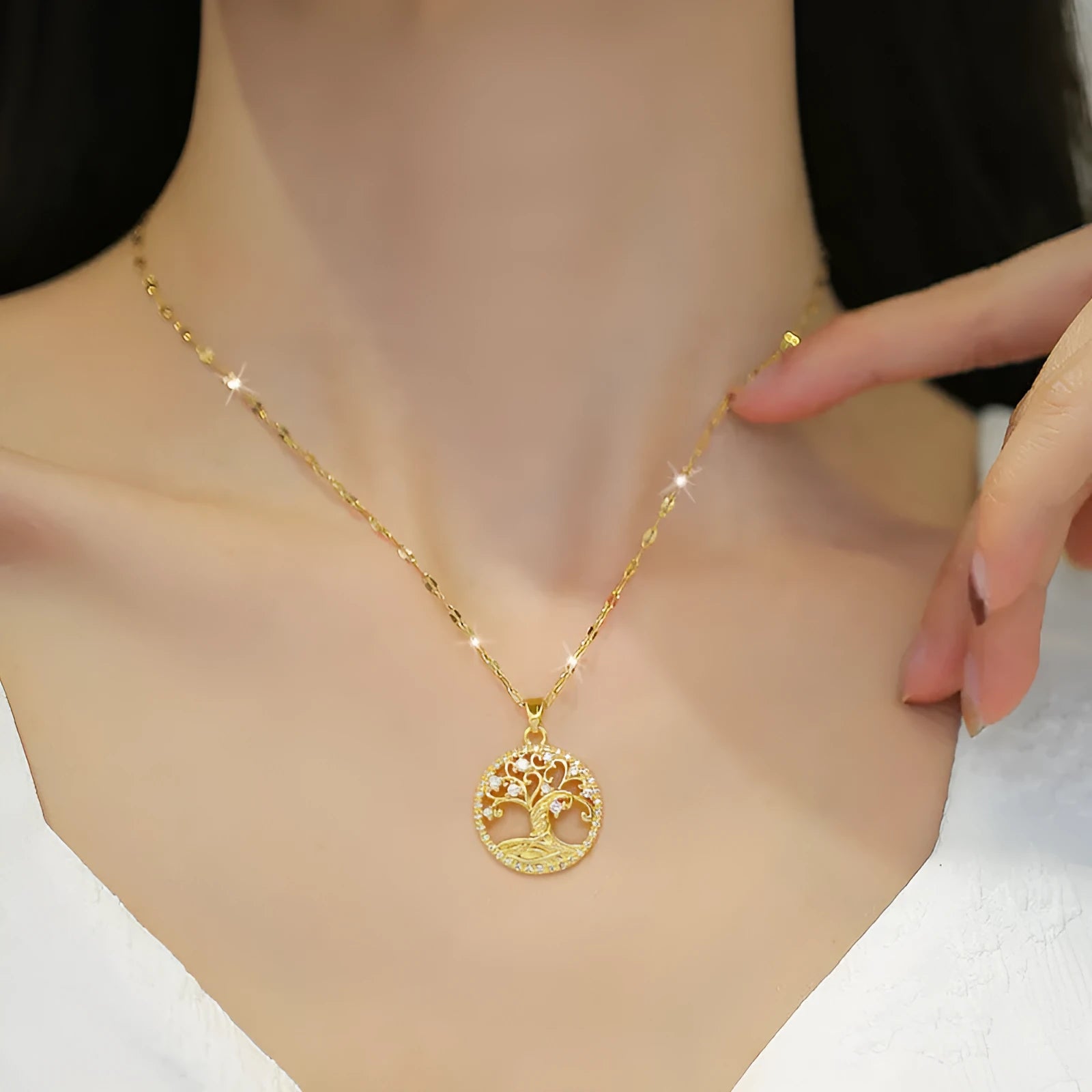 Gold-coloured adjustable necklace with an iridescent mother-of-pearl cross pendant on a detailed lip chain.