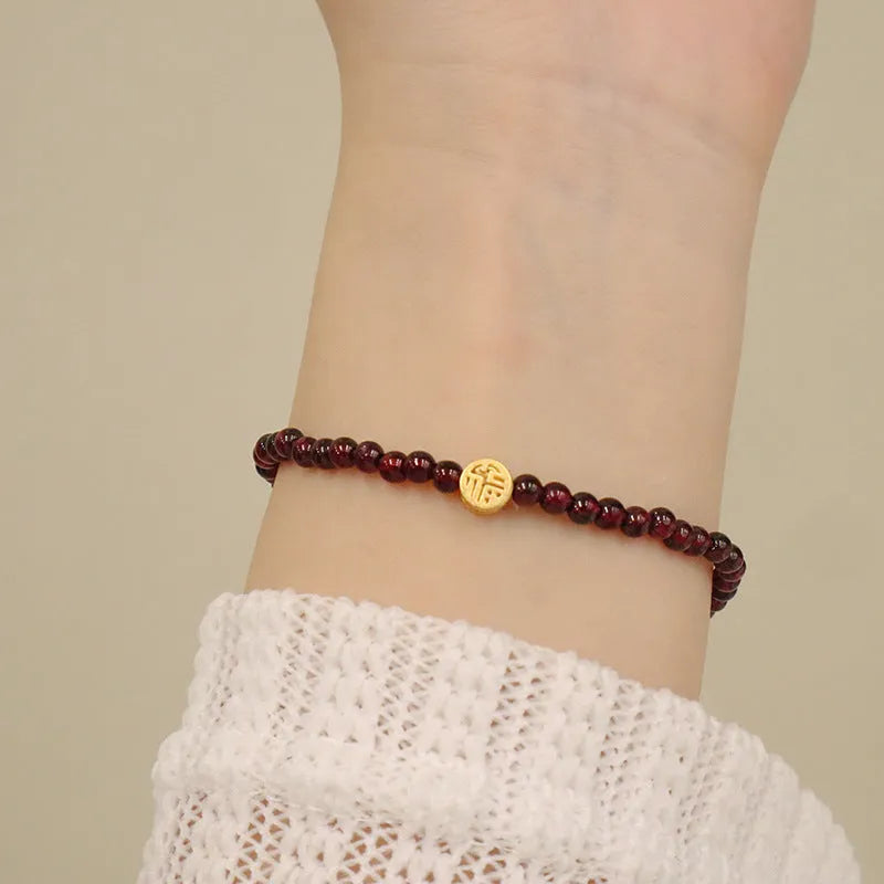 Chinese-style gourd bracelet with imitation garnet beads and Fu character symbols on U-shaped electroplated setting